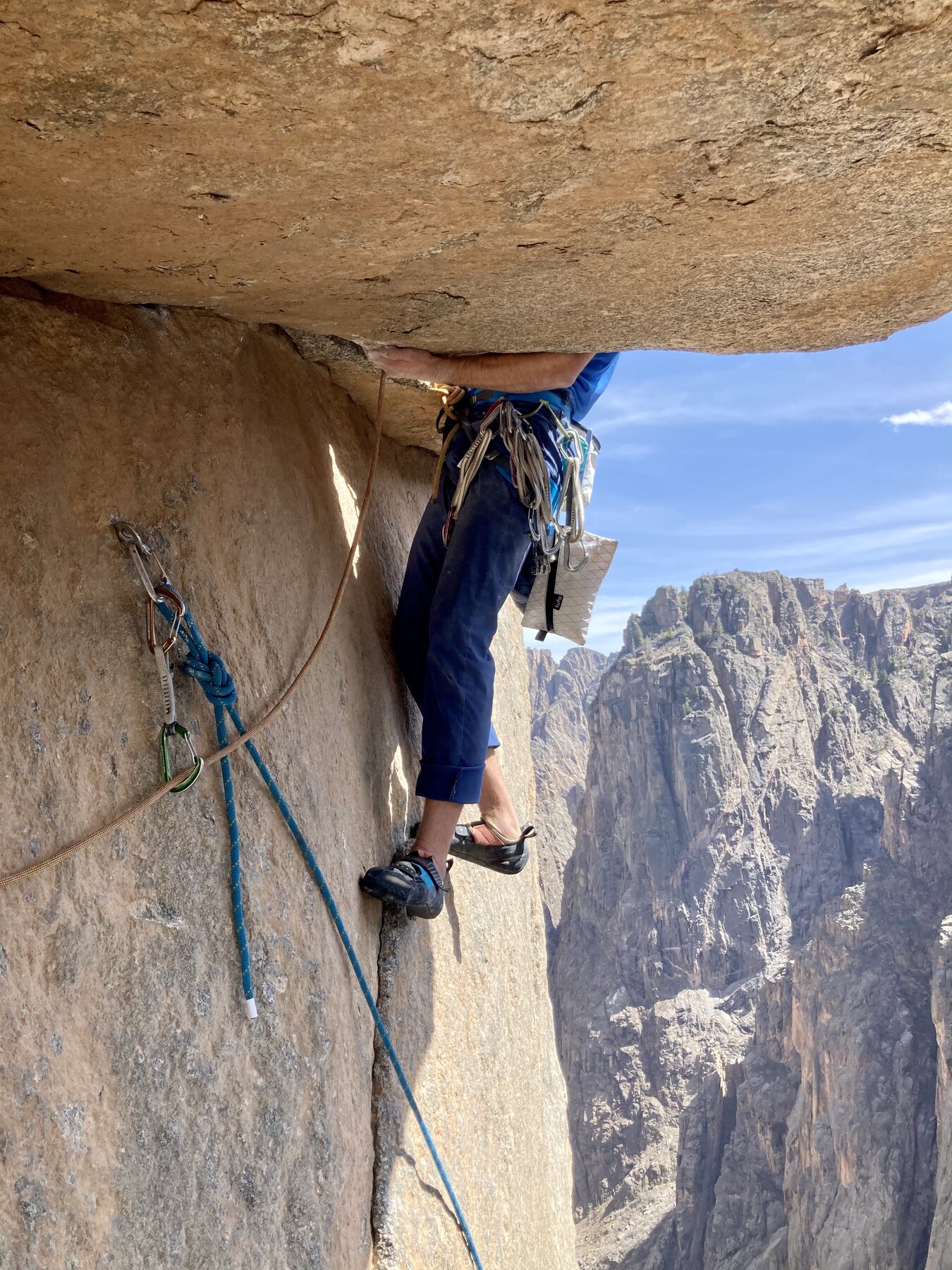 Michal Matyjasik pulling the roof on The Free Hallucinogen Wall, Black Canyon of the Gunnison below