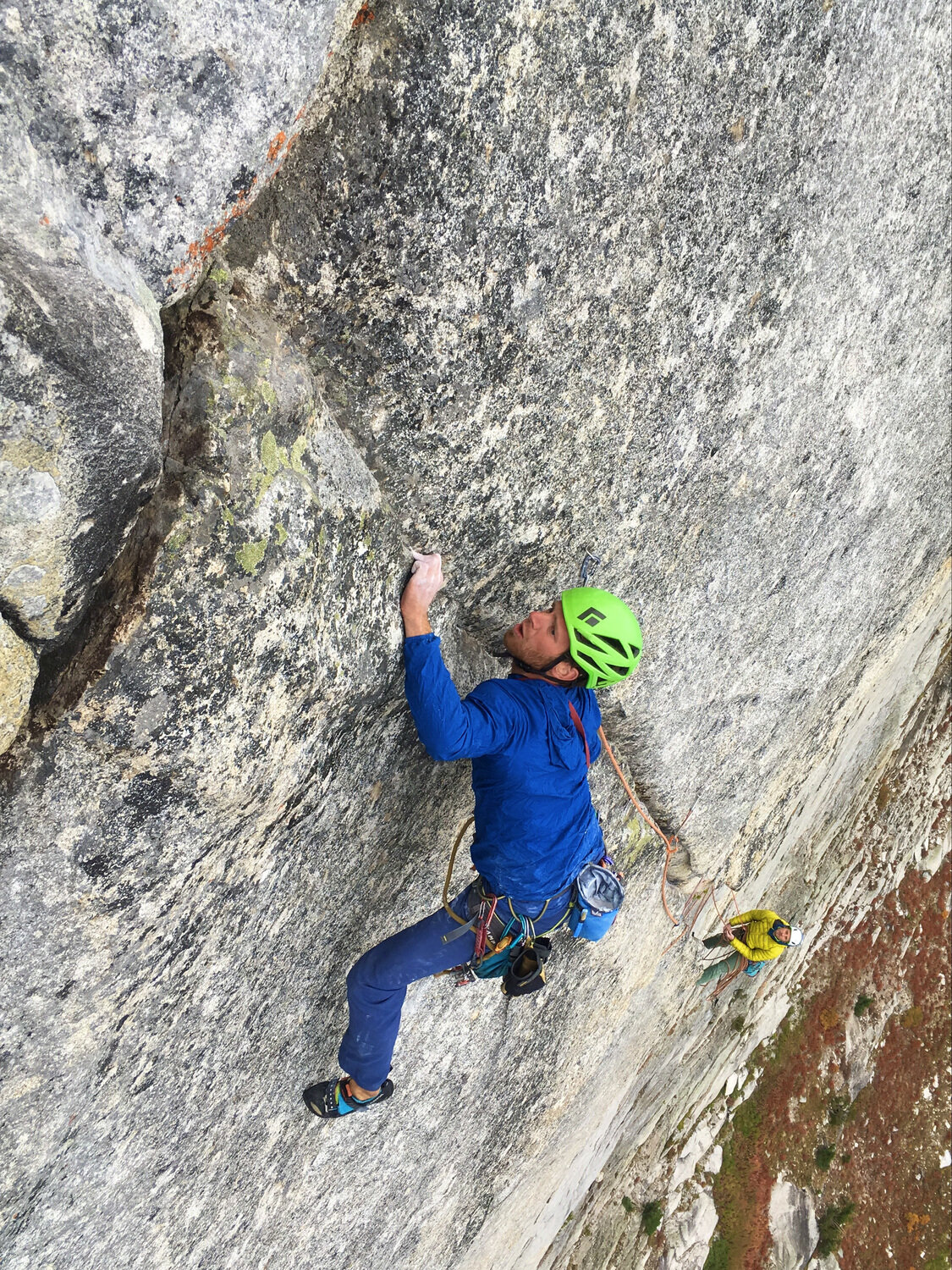 Michal Matyjasik leading a granite face pitch of Milwaukee's Best on Storm Dome, belayer below