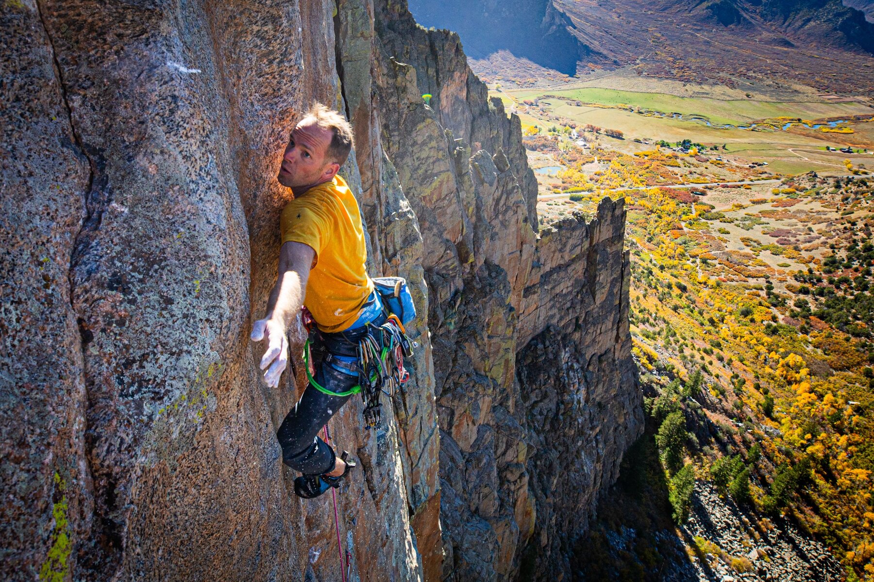 Michal Matyjasik on The Gem, Unaweep Canyon, with the valley below